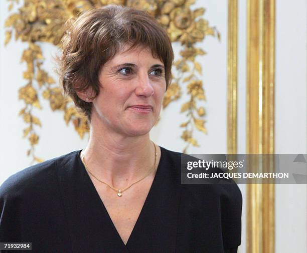 French Catherine Belrhiti two-time Karate World Champion, poses after being awarded by French Prime Minister Dominique de Villepin with the insigna...