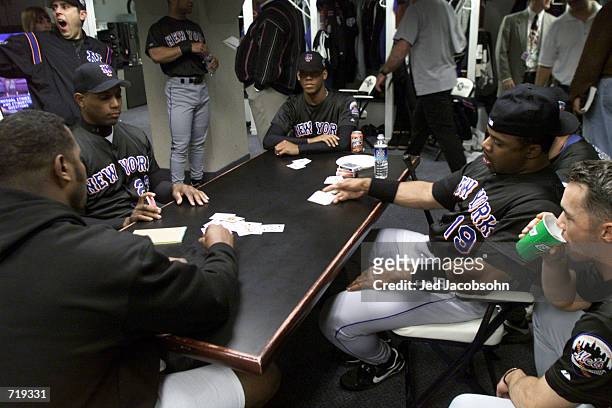 Members of the New York Mets play cards in the clubhouse the day before game 1 of the World Series against the New York Yankees at Yankee Stadium in...