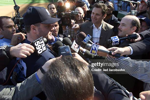 Roger Clemens of the New York Yankees is interviewed by the media the day before game 1 of the World Series against the New York Mets at Yankee...