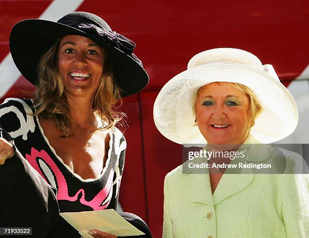 Melissa Lehman and Glendryth Woosnam smile as USA and European team wives prepare to travel to The Curragh racecourse for the Wives Race Day prior to...