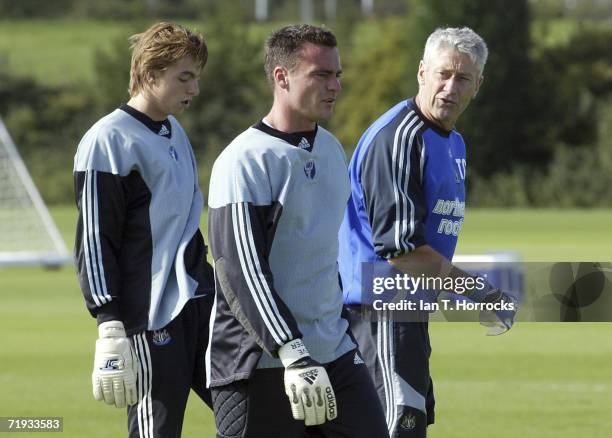 Substitute goalkeepers Steve Harper and Tim Krul speak to goalkeeping coach Terry Gennoe Newcastle United Training on September 19, 2006 in...