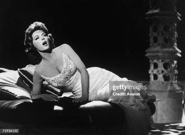 American actor and singer Julie London , rehearsing a television special, circa 1955.