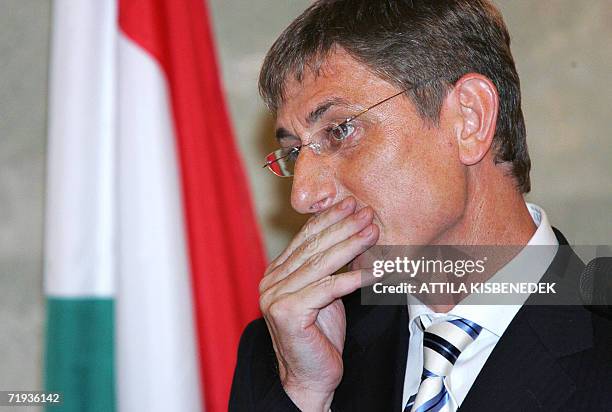 Hungarian Prime Minister Fernc Gyurcsany listens to a journalist's question at the Parliament's Delegation Hall during his international press...