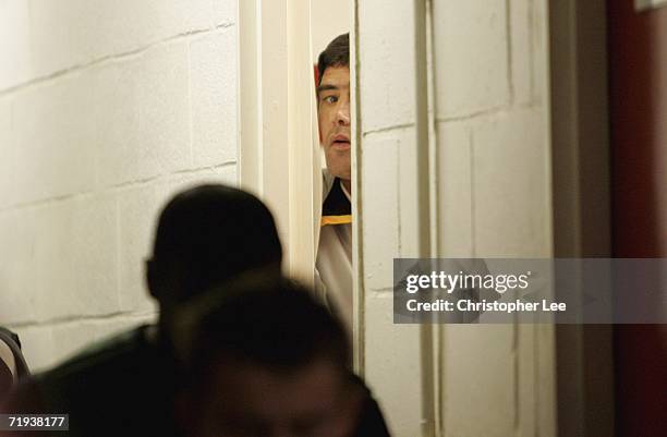 Luton Town manager Mike Newell looks out from the dressing room before kick off during the Carling Cup second round match between Brentford and Luton...