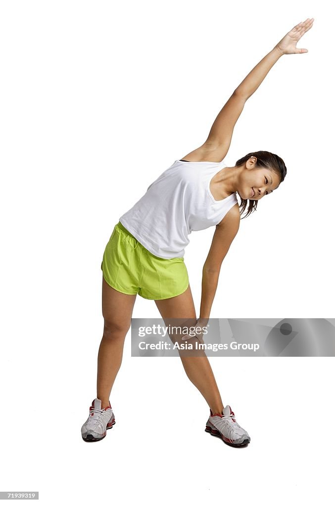 Young woman doing stretching exercises