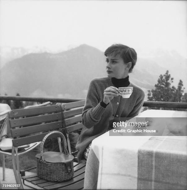 Belgian-born actress Audrey Hepburn on the terrace of the Restaurant Hammetschwand at the summit of the Bürgenstock, Switzerland, circa 1955.