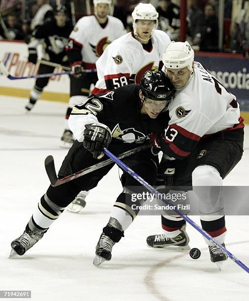 Forward Jordan Staal of the Pittsburg Penguins tries to get past Jamie Allison Ottawa Senators during NHL preseason action September 19, 2006 at the...