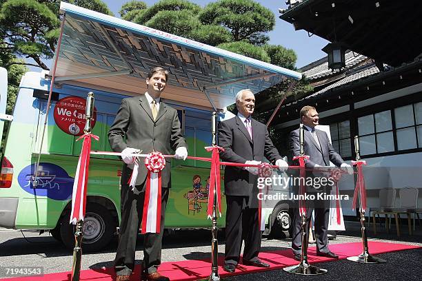 The U.S. Meat Export Federation's Japan director Gregory P. Hanes, Philip M. Seng , President and CEO and Chairman John W. Bellinger cut a ribbon...