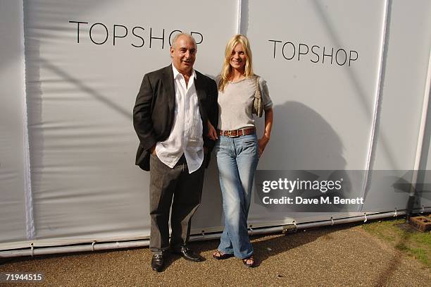 Model Kate Moss and retail businessman Sir Philip Green attend the Topshop Fashion Show in Holland Park on September 17, 2006 in London, England....