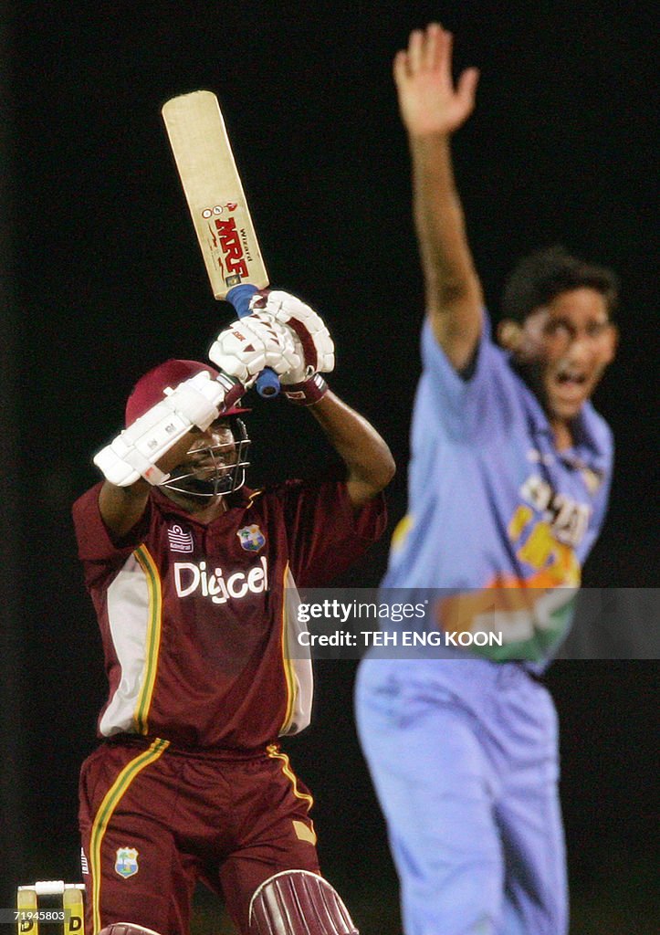 West Indian captain Brian Lara (L) raise