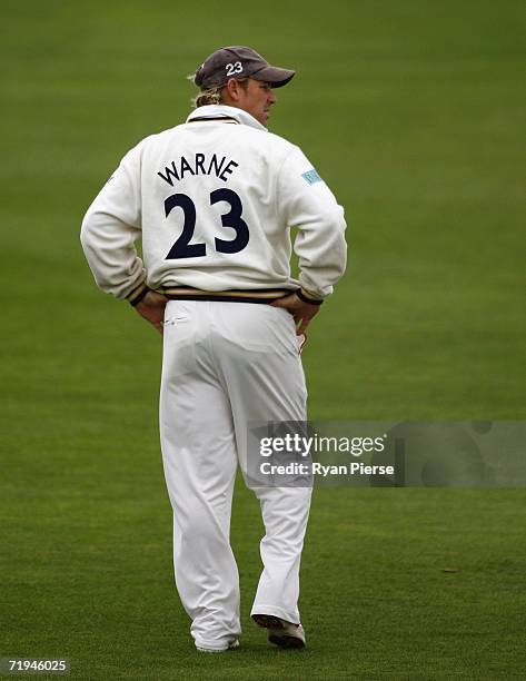 Shane Warne of Hampshire looks on while fielding during day one of the Liverpool Victoria Insurance County Championship match between Hampshire and...