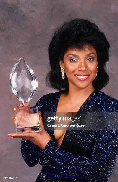 Actress and star of "The Cosby Show," Phylicia Rashad, poses with her People's Choice Award in a 1989 backstage Beverly Hills, California telecast...