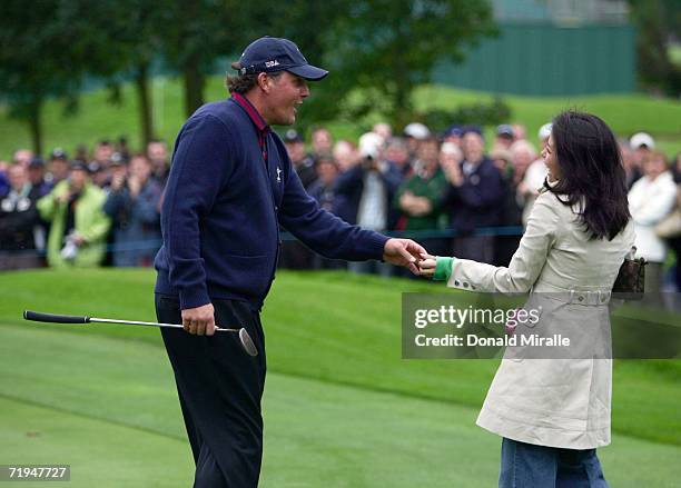 Phil Mickleson of USA gives golf fan Joanne Shannon his ball on the 1st green during the second official practice day of the 2006 Ryder Cup at The K...