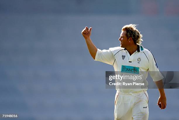 Shane Warne of Hampshire instructs his fieldsmen during day one of the Liverpool Victoria Insurance County Championship match between Hampshire and...