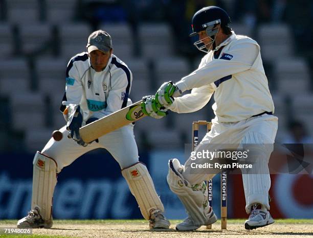 Nathan Astle of Lancashire plays a cut shot as Nic Pothas of Hampshire keeps wicket during day one of the Liverpool Victoria Insurance County...
