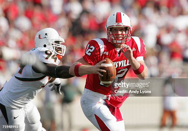 Brian Brohm of the Louisville Cardinals moves as he looks to pass during the game against the Miami Hurricanes at Papa John's Stadium on September...