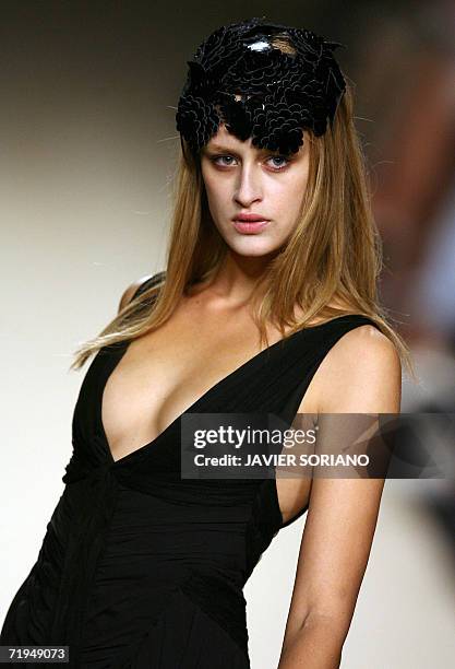 Model displays an outfit by Spanish designer Lydia Lozano, part of her Spring/Summer 2007 collection at Madrid fashion week, 20 September 2006. AFP...
