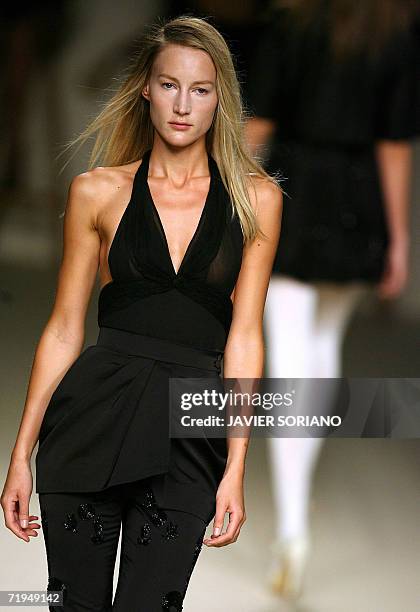 Model displays an outfit by Spanish designer Lydia Lozano, part of her Spring/Summer 2007 collection at Madrid fashion week, 20 September 2006. AFP...