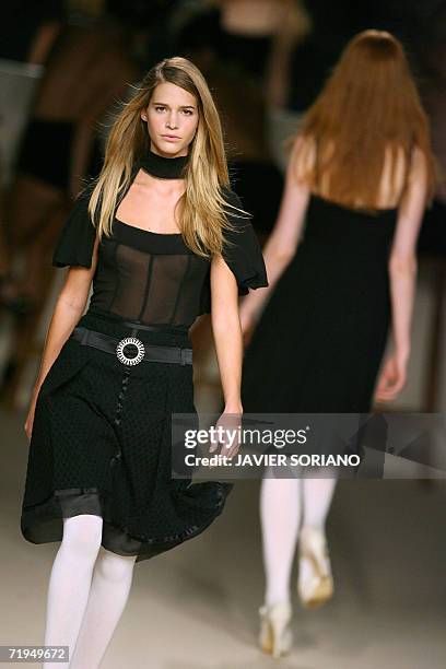 Model displays an outfit by Spanish designer Lydia Lozano, part of her Spring/Summer 2007 collection at Madrid fashion week, 20 September 2006. AFP...