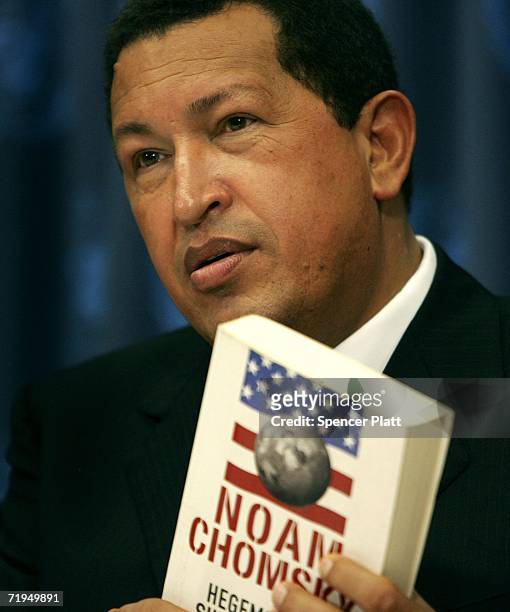 Venezuelan President Hugo Chavez holds up the Spanish-edition of "Hegemony or Survival: America's Quest for Global Dominance " by author Noam Chomsky...