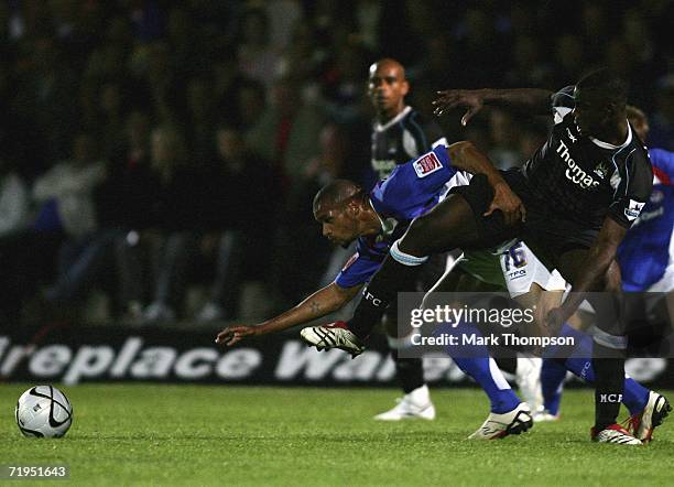 Caleb Folan of Chesterfield tangles with Trevor Sinclair of Manchester City during the Carling Cup 2nd round match between Chesterfied and Manchester...