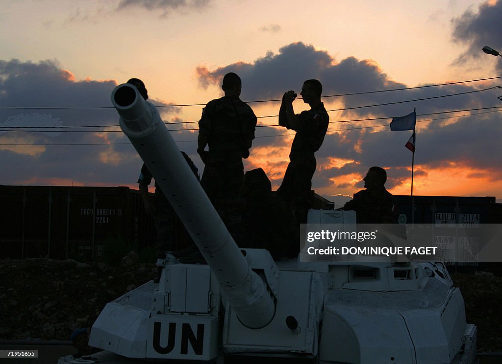 French UNIFIL soldiers stand on top of a