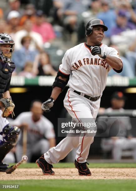 Barry Bonds of the San Francisco Giants follows through on a pinch hit RBI single to take the lead away from the Colorado Rockies in the eighth...