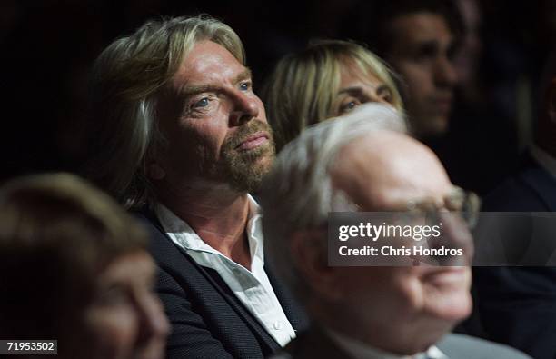 Virgin CEO Sir Richard Branson , and billionaire investor Warren Buffett sit in the audience during the Clinton Global Initiative annual meeting...