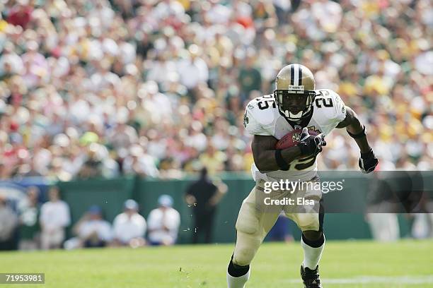 Running back Reggie Bush of the New Orleans Saints runs with the ball during the game against the Green Bay Packers on September 17, 2006 at Lambeau...