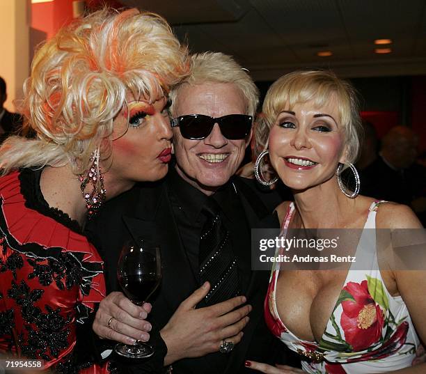 Drag queen Olivia Jones, singer Heino and porn queen Dolly Buster attend the "Goldene Henne" awards after show party at the Friedrichstadtpalast on...