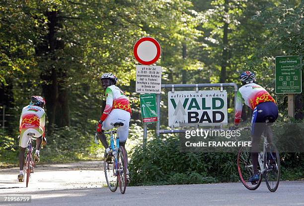 Burkina Faso's competitors Saidou Rumba , Jeremi Ouedraogo and Abdul Wahab Sawadogo pose before a training 21 September 2006 for the men's road race...