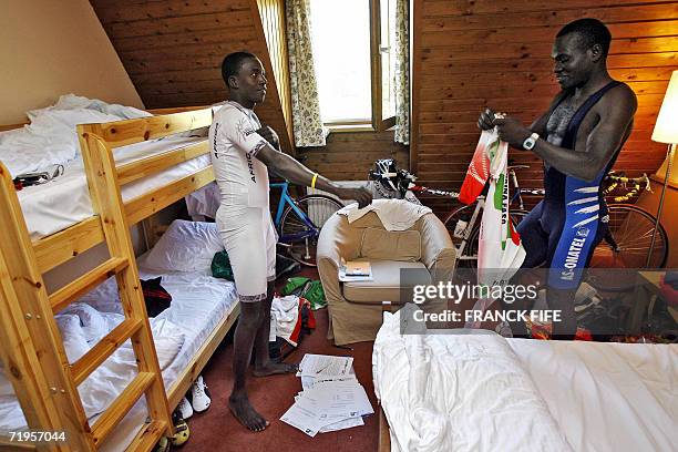 Jeremi Ouedraogo and Abdul Wahab Sawadogo chat before training 21 September 2006 for the men's road race at the 2006 UCI world road cycling...