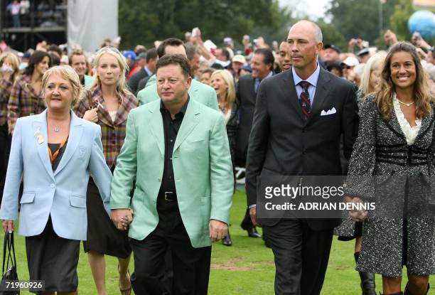 United States Ryder Cup team captain Tom Lehman and his wife Melissa accompany European team captain Ian Woosnam and his wife Glendryth, as they...