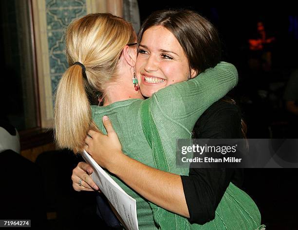 Dana Gibbons of Utah hugs her cousin Megan Gibbons of Utah after Dana Gibbons earned a callback audition for the USA Network's "Nashville Star"...