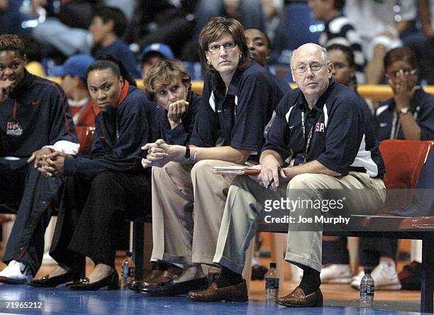 Dawn Staley, assistant coach, Gail Goestenkors, assistant coach, Anne Donovan, head coach and Mike Thibault, assistant coach of USA watch the action...