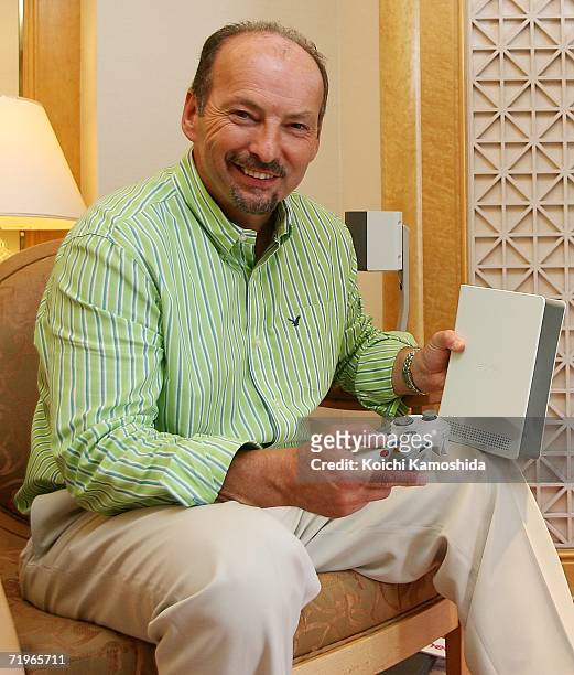 Peter Moore, Vice President of Microsoft Corporation shows the Xbox 360 game console on September 22, 2006 in Chiba Prefecture, Japan. Microsoft will...