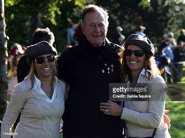 Amy Mickelson and Amy DiMarco pose with former United States President George Bush during the morning fourballs of the first day of the 2006 Ryder...