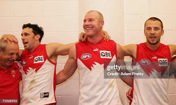 Nick Davis, Barry Hall and Nick Malceski of the Swans celebrate after the winning the First Preliminary AFL final between the Sydney Swans and the...