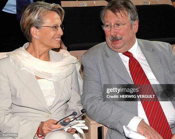French Defence Minster Michele Alliot-Marie chats with her Belgian counterpart Andre Flahaut after being decorated as Doctoris Honoris Causa of the...