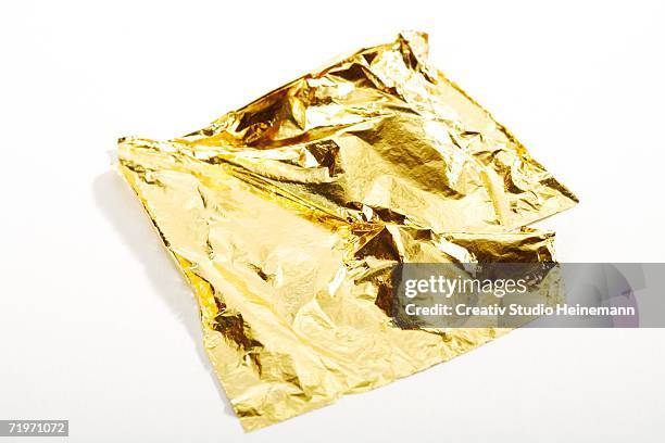 leaf of gold, elevated view, close-up - gold foil stock-fotos und bilder