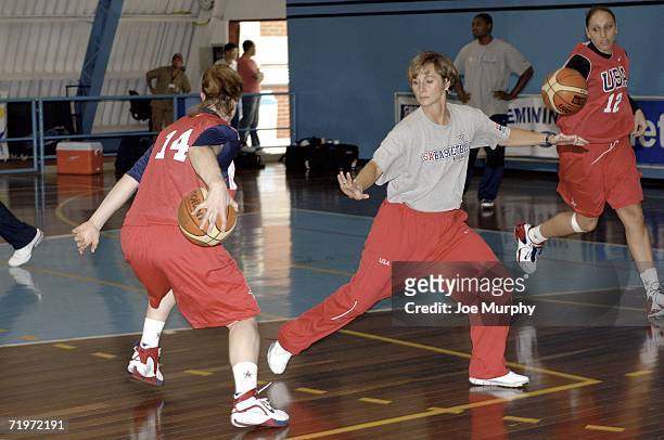 Gail Goestenkors, assistant USA coach, guards against Katie Smith during a practice for Team USA during the 2006 FIBA World Championship For Women at...