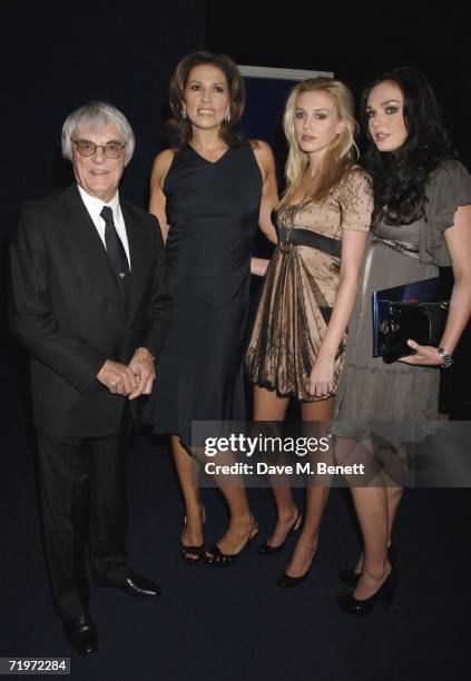 Bernie Ecclestone with wife Slavica Ecclestone and daughters Petra and Tamara attend the fashion show and party to celebrate the launch of Emporio...