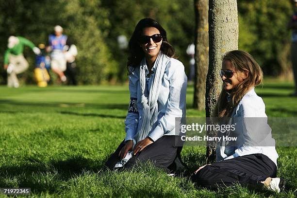 Luke Donald's fiancee Diane Antonopoulos watches the action with Sergio Garcia's girlfriend Morgan Norman during the morning fourballs of the first...