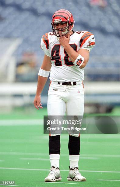 Brad St. Louis of the Cincinnati Bengals stands on the field before the game against the Pittsburgh Steelers at the Three Rivers Stadium in...