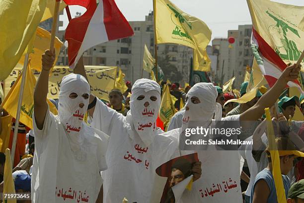 Hezbollah supporters wave flags during a ''Victory over Israel'' rally in Beirut's suburbs on September 22, 2006 in Beirut, Lebanon. Hezbollah leader...