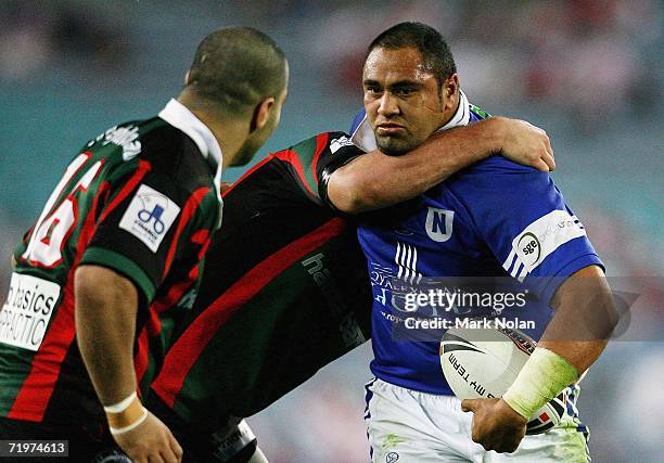 Ritchie Parker of the Jets is tackled high during the Jim Beam Cup Grand Final match between the Sydney Bulls and the Newtown Jets at Telstra Stadium...