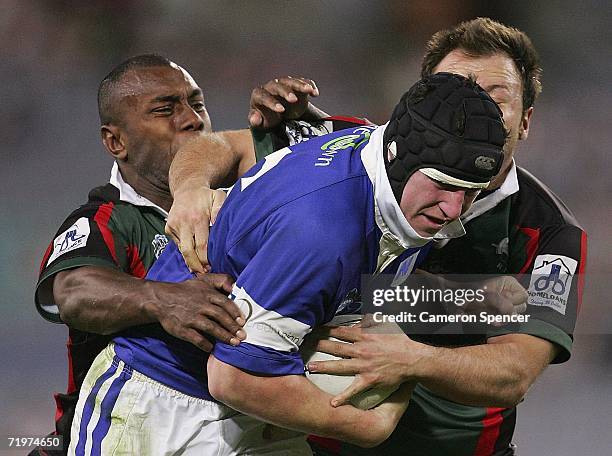 Tim Chalmers of the Jets is tackled during the Jim Beam Cup Grand Final match between the Sydney Bulls and the Newtown Jets at Telstra Stadium on...