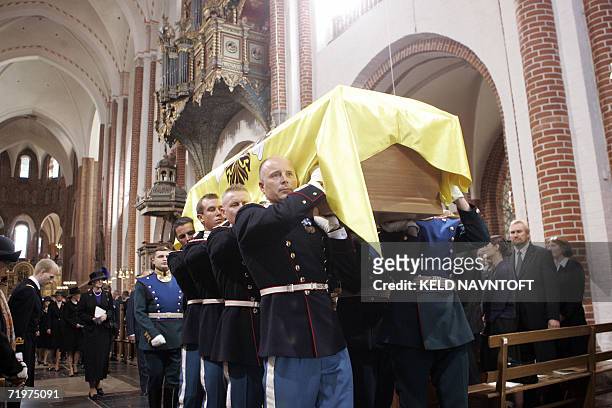 Soldiers of the Royal Danish Guard and the Russian Presidential Guard carry the sarcophagus of Danish Princess Dagmar, who later took the name of...