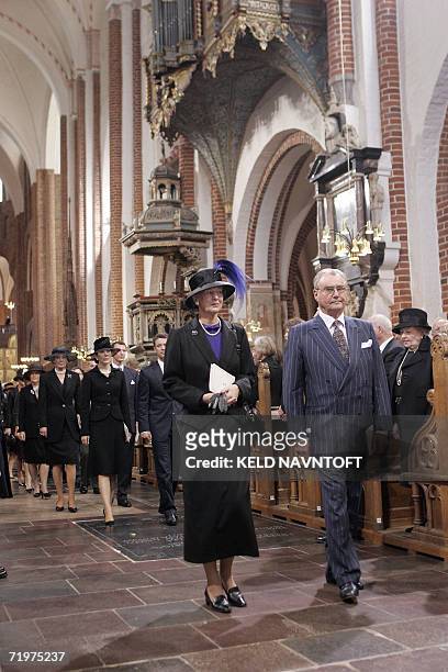 Danish Queen Margrethe and Prince Consort Henrik leave during the re-burial ceremony of Danish Princess Dagmar, who later took the name of Maria...