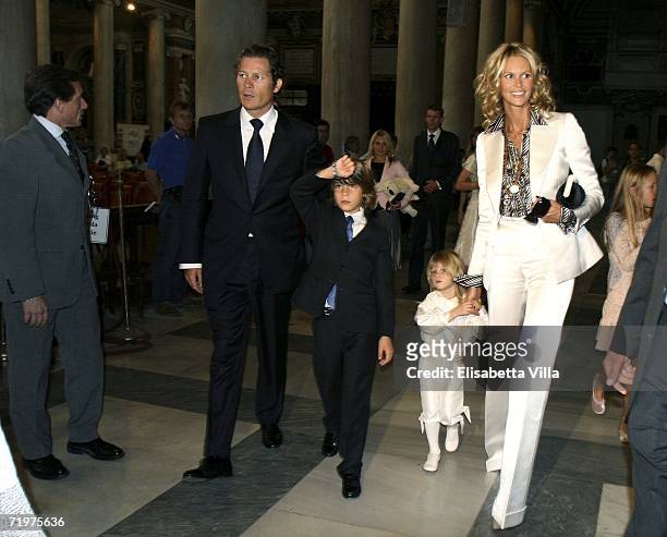 Elle Macpherson arrives with her partner Arpad Busson and their sons Flynn and Aurelius for the christening of Aurelius at Basillica Santa Maria...